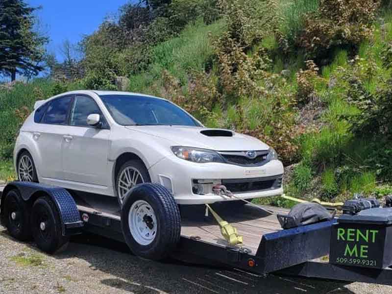 Titan car trailer with powered winch for easy loading and vehicle transport in Spokane